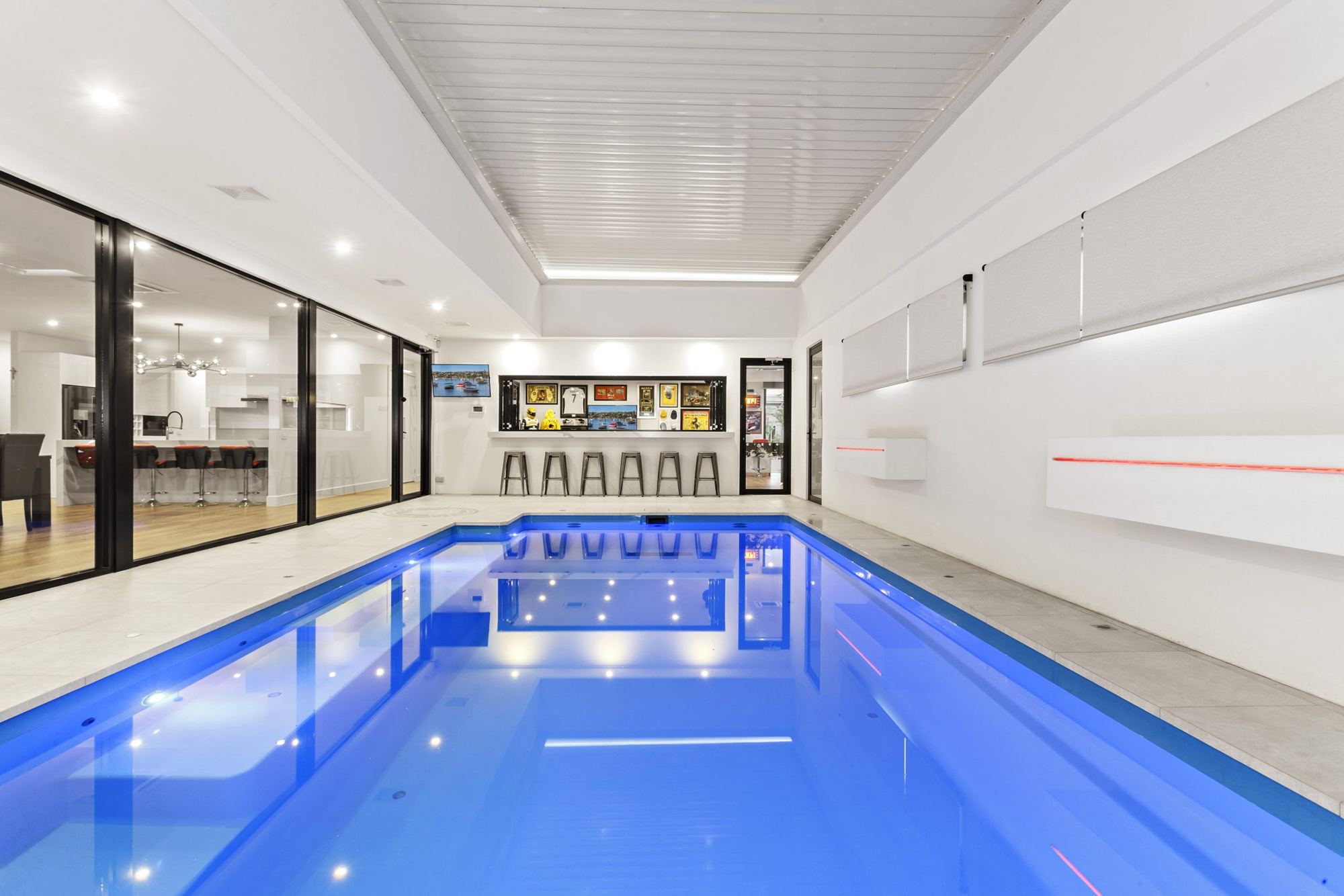 Indoor lap pool with full-height glazing