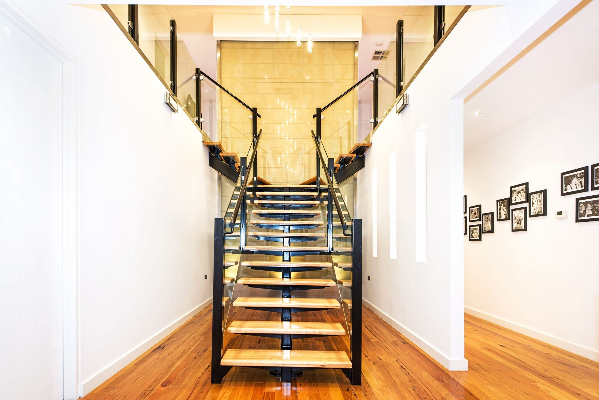 Floating timber staircase and entrance